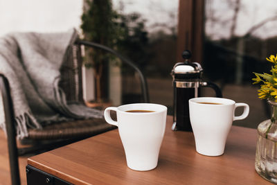 Close-up of coffee cup on table