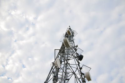 Low angle view of communications tower against sky