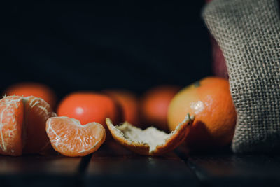 Close-up of orange slice on cutting board