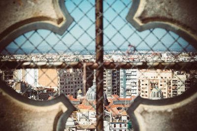 Close-up of buildings seen through window