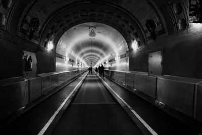Illuminated tunnel at subway station