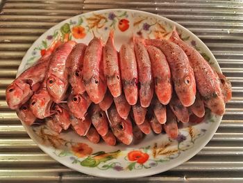 Close-up of fishes in plate on table