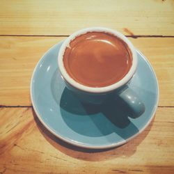 High angle view of black coffee on table