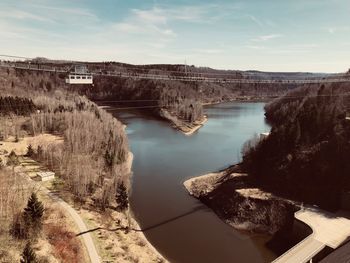 High angle view of dam by river against sky