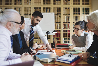 Lawyers discussing in meeting at library