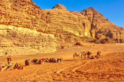 Scenic view of desert against mountain range