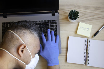 Man using laptop on table