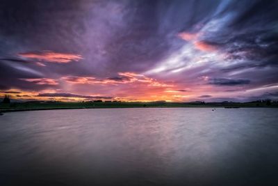 Scenic view of landscape against cloudy sky