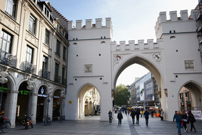 Neuhauser street and karlsplatz gate in city