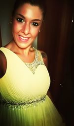 Close-up portrait of smiling young woman