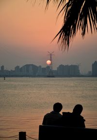 Silhouette of city at sunset