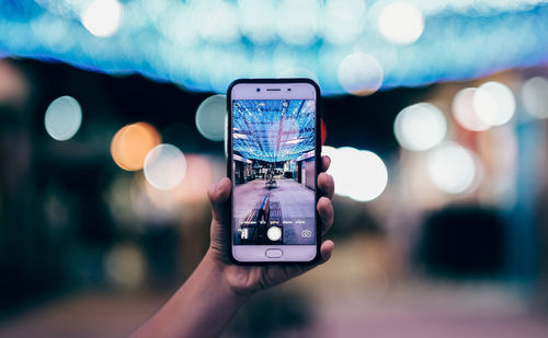 Close-up of hand holding smart phone