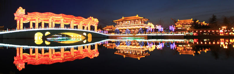 Reflection of illuminated buildings in water