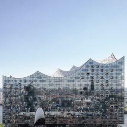 Modern office building against blue sky