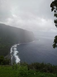 Scenic view of landscape against cloudy sky
