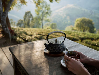 Woman drinking tea in garden