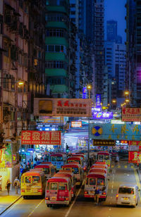 Traffic on city street and buildings at night