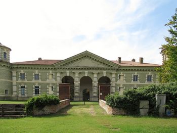 Facade of historic building against sky