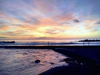 Scenic view of sea against sky at sunset