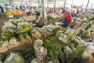 Group of people for sale at market stall