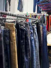 Close-up of clothes hanging in store