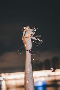 Close-up of woman holding umbrella