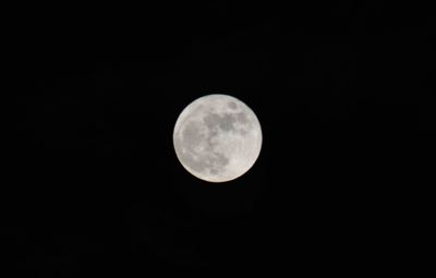 Low angle view of full moon in sky