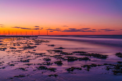 Scenic view of sea against sky at sunset