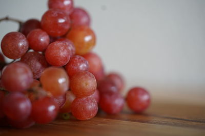 Close-up of grapes on table