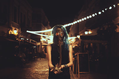 Portrait of young woman at night