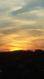 Scenic view of silhouette landscape against sky during sunset