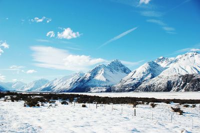 Scenic view of snowcapped mountains against sky