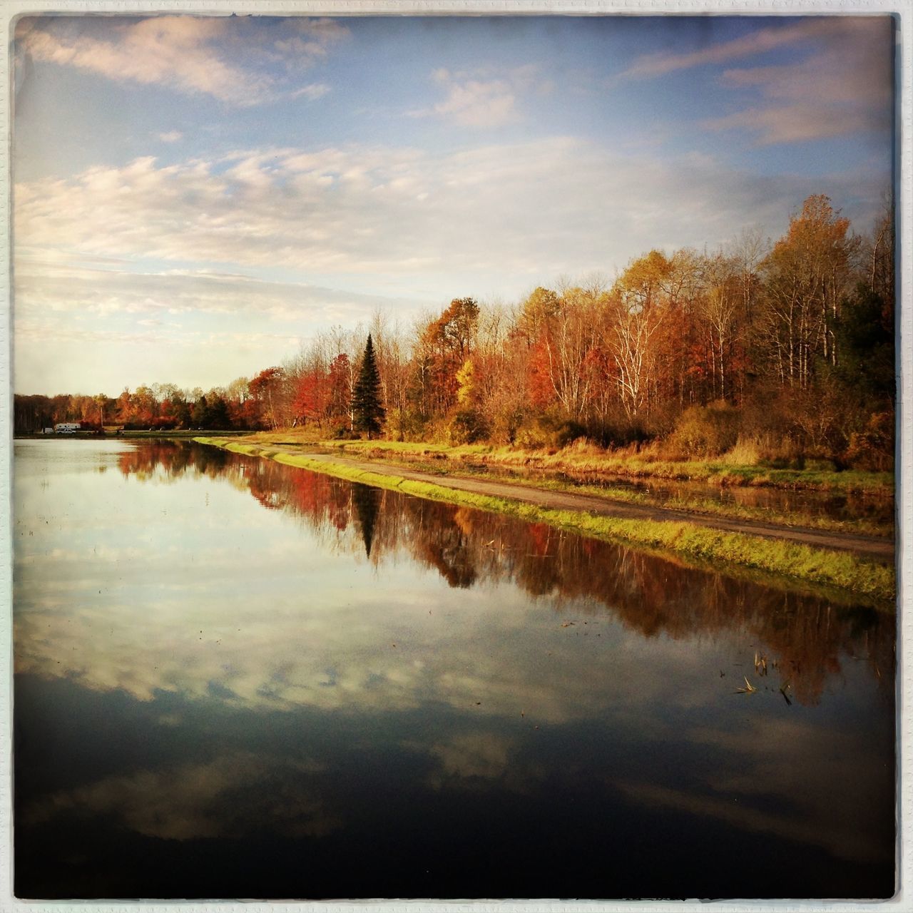 reflection, water, tree, lake, tranquil scene, tranquility, transfer print, scenics, beauty in nature, auto post production filter, sky, nature, waterfront, autumn, standing water, idyllic, outdoors, calm, cloud - sky, season