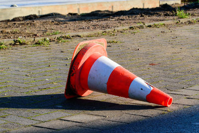 Close-up of red umbrella on beach