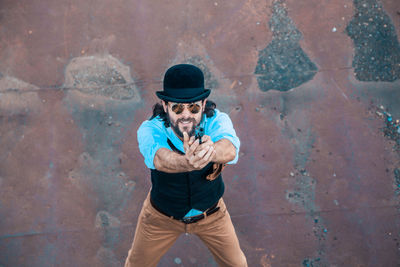 High angle view of man wearing hat in city