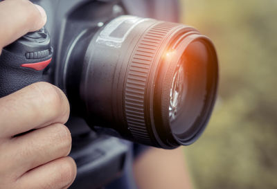 Close-up of hand holding camera