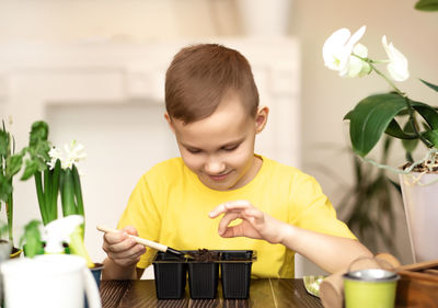 Boy playing with friend at home