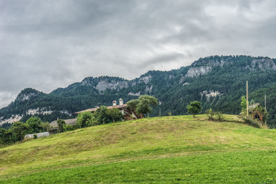 Scenic view of landscape and mountains against sky