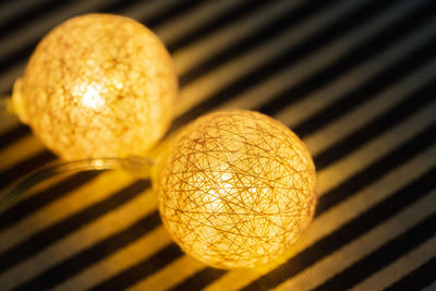 Close-up of illuminated lights on table