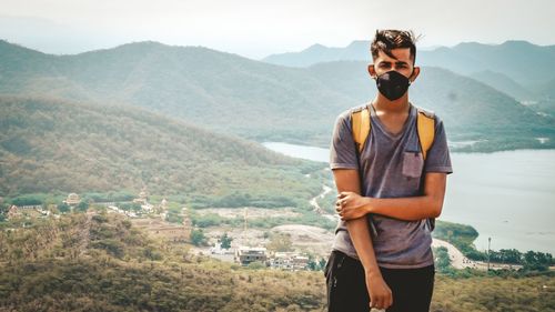 Young man looking at mountains