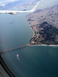 Aerial view of city by sea