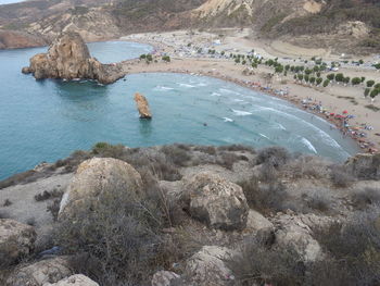 High angle view of rocks on sea shore