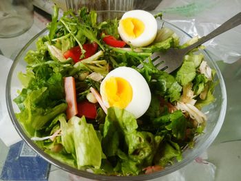 High angle view of boiled eggs with salad in bowl