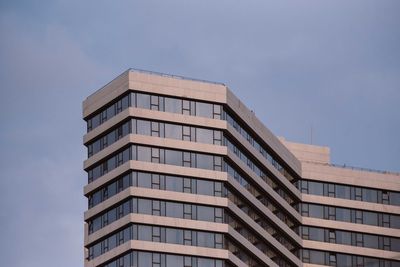 Low angle view of modern building against sky