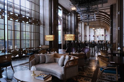 Large interior of a moody sofa living area hall no people restaurant