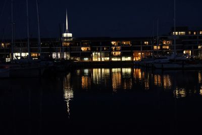 Reflection of illuminated buildings in water at night