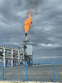 Smoke stacks against sky