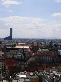 High angle view of buildings in city against sky