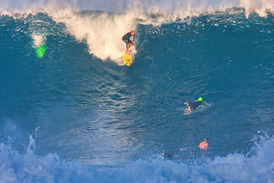 High angle view of people in sea