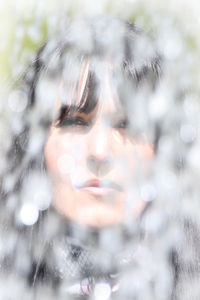 Close-up portrait of teenage girl during winter